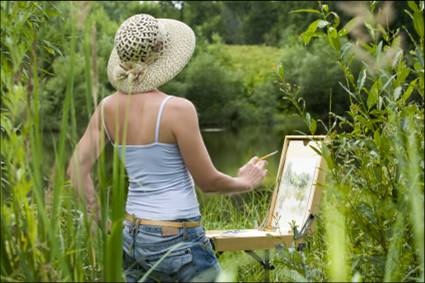 Woman painting outdoors