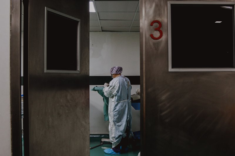 nurse in dark corridor